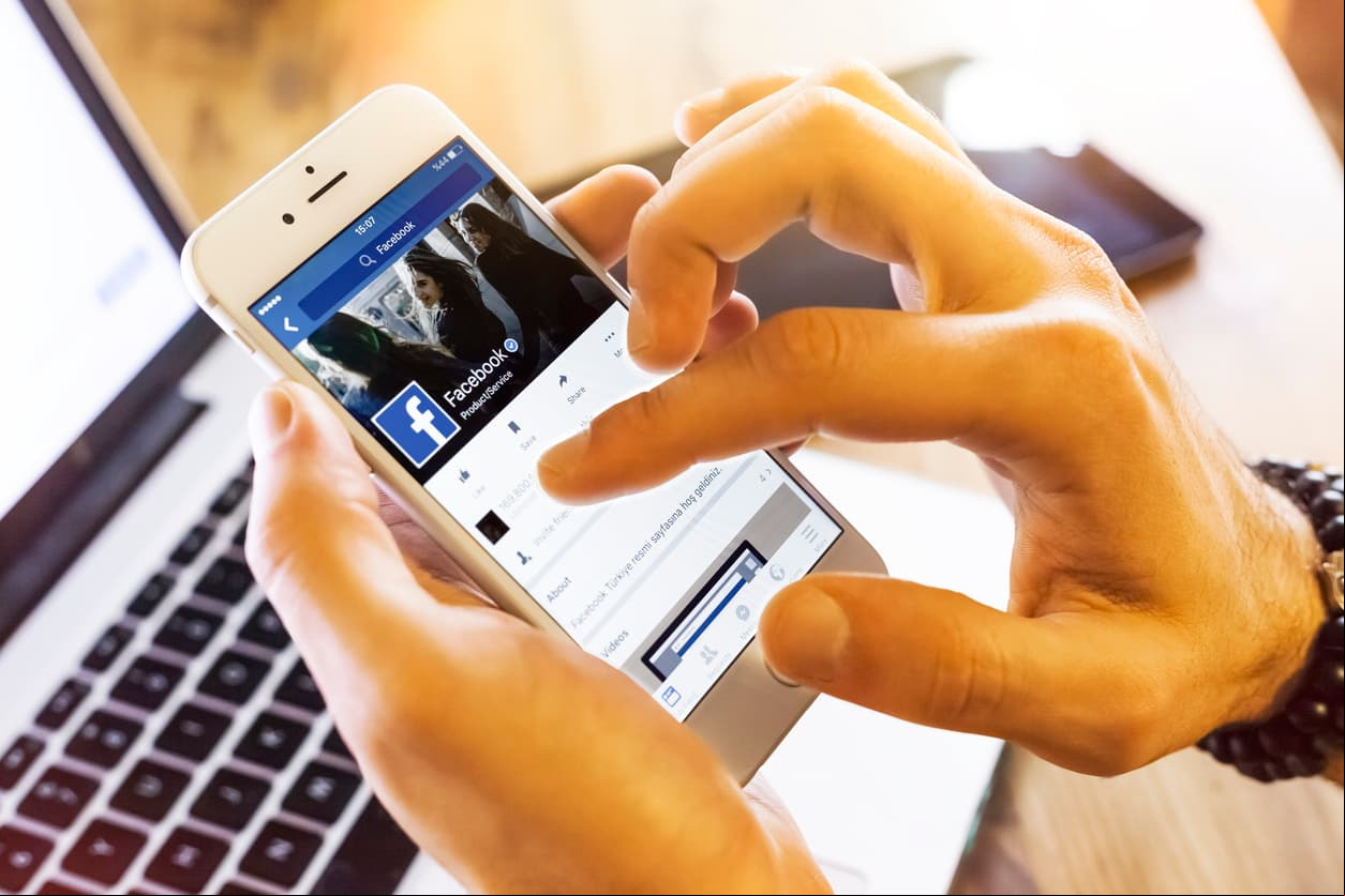 Istanbul, Turkey - January 13, 2016: Person holding a brand new Apple iPhone 6s with Facebook profile on the screen. Facebook is a social media online service for microblogging and networking, founded in February 4, 2004.