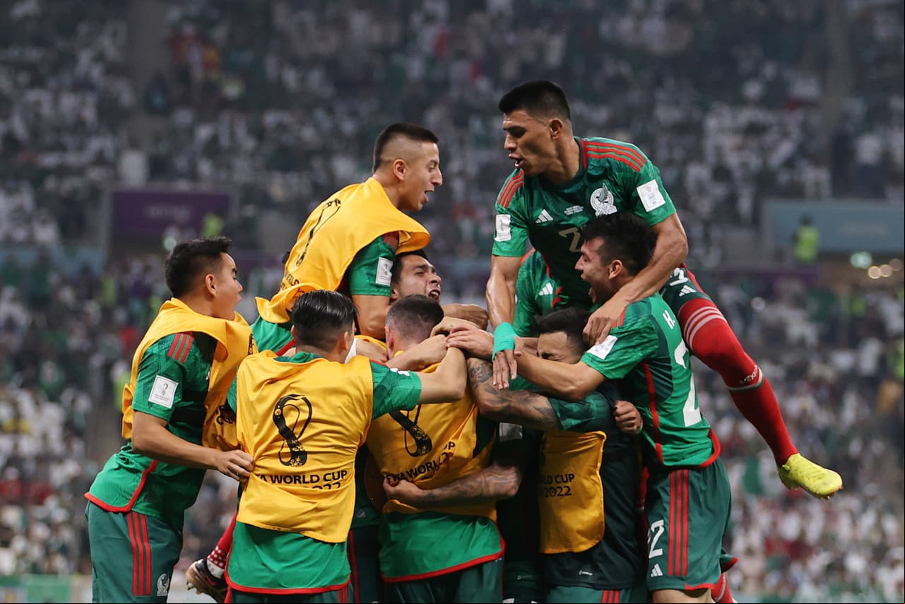 LUSAIL CITY, QATAR - NOVEMBER 30: Luis Chavez of Mexico celebrates with teammates after scoring their team's second goal during the FIFA World Cup Qatar 2022 Group C match between Saudi Arabia and Mexico at Lusail Stadium on November 30, 2022 in Lusail City, Qatar. (Photo by Michael Steele/Getty Images)